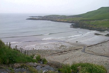 Picture of a view over a bay, waves coming in