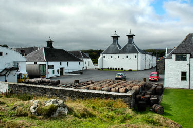 Picture of a view over the yard of a distillery (Ardbeg) with stored casks