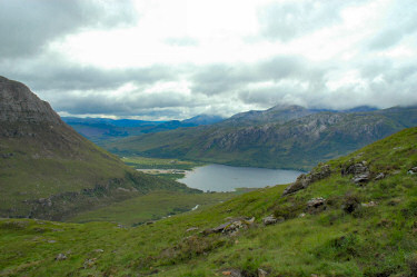 Picture of a view down a glen (valley) to a loch (lake)