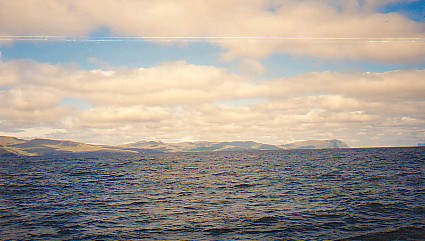 Sailing past the main island, approaching Torshavn