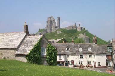 Picture of the ruins of Corfe Castle over the village