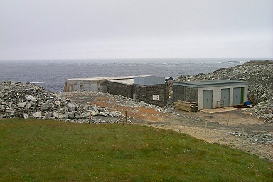 Picture of a building (a wave power station) on the shore under construction