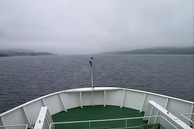 Picture of a view ahead of the ferry into a grey and overcast loch