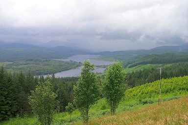 Picture of a loch (lake) with clouds and rain moving in