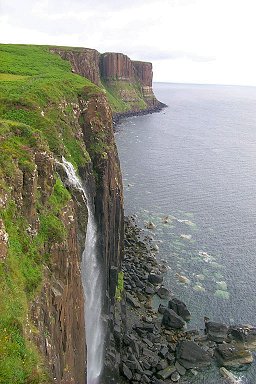 Picture of a waterfall going over cliffs into the sea