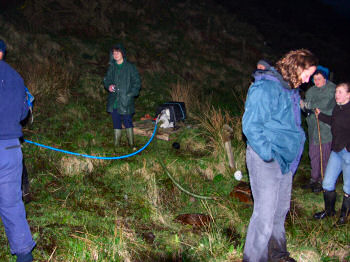 Picture of people around the Octomore Well