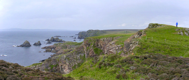 Picture of the west coast of The Oa, Imke walking along the cliffs