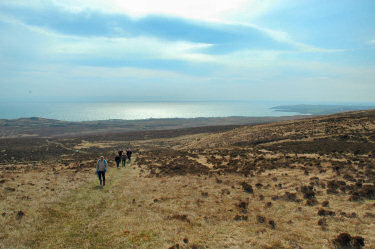 Picture of walkers walking up the hill from Ardtalla