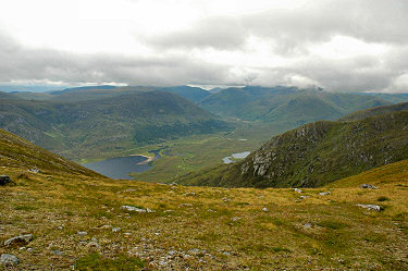 Picture of a view down towards a loch and into a glen in the distance