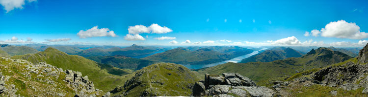 Picture of a panoramic view over hills and lochs in beautiful sunshine