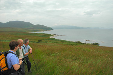 Picture of walkers looking over a bay