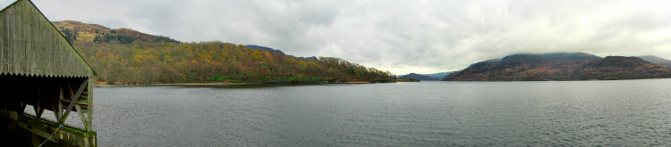 Picture of a panoramic view over a loch from a pier with a boathouse