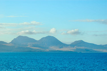 Picture of three mountains on an island