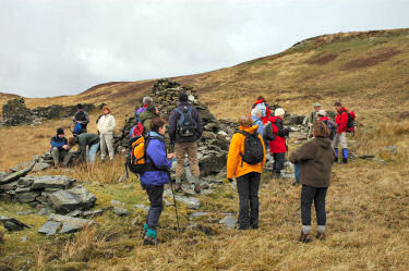 Picture of walkers at the ruins of an old steading