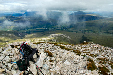 Picture of a view over a cairn down into a glen