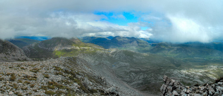 Picture of a panoramic view from a mountain over a dramatic landscape