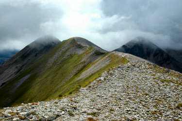 Picture of a mountain ridge with low clouds in places