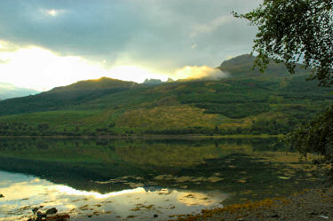 Picture of a view over a sea loch to a mountain range with a distinctively shaped mountain