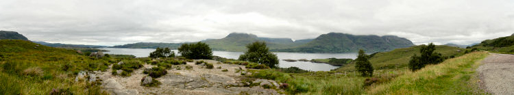 Picture of a panoramic view over a sea loch, hills in the background