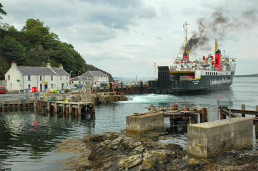 Picture of a ferry (the Isle of Arran) leaving a small ferry terminal