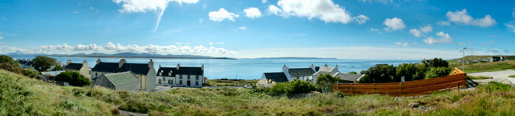 Picture of a panoramic view over a sea loch (Loch Indaal, Islay) on a beautiful sunny day