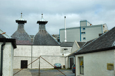 Picture of an old distillery kiln with modern maltings in the background