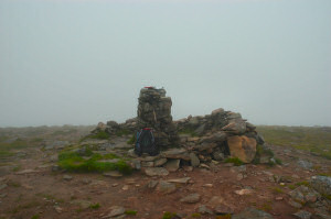 Picture of a trig point in the clouds