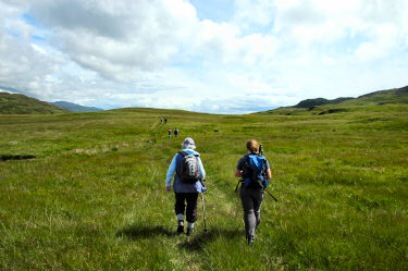 Picture of walkers crossing a wide plateau