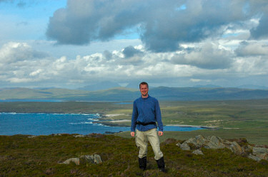 Picture of a man on low hills on an island