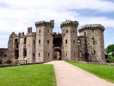 Picture of the path approaching the gatehouse of Raglan Castle with the gatehouse towering over it