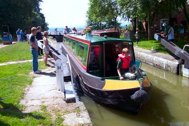 A canal boat leaving a lock