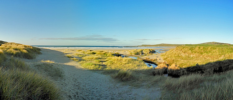 Picture of a panoramic view over a beach from the dunes at the entrance to the beach