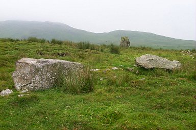 Cultoon Stone Circle with the hills in the background covered in mist