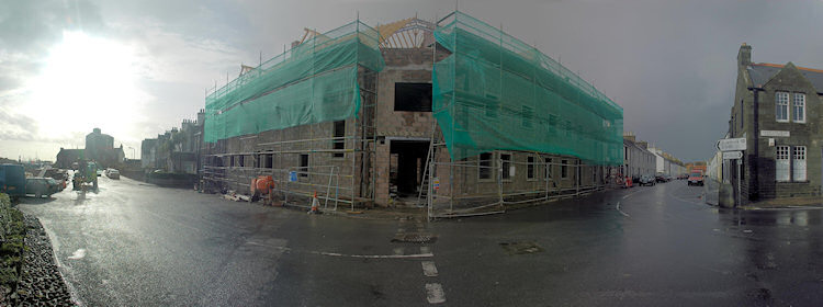 Panorama picture of a building site for a hotel, the second floor is nearing completion