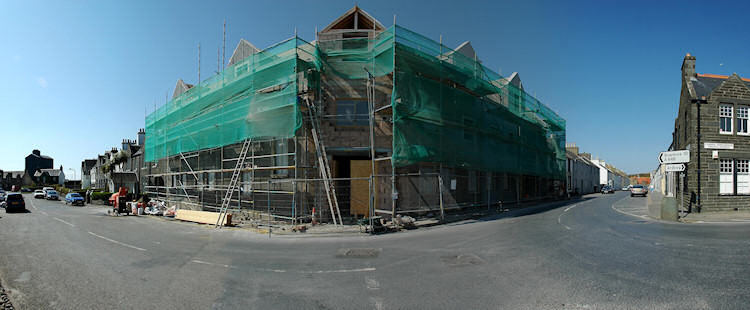 Panorama picture of a building site for a hotel, the second floor is completed
