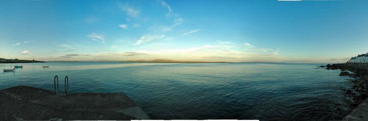 Picture of a panoramic view over a sea loch at the evening