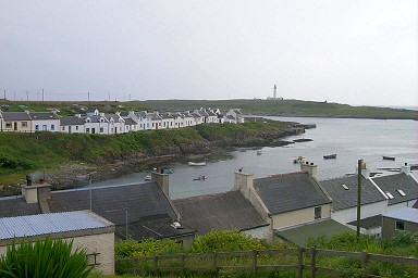 Picture of King Street in Portnahaven with Orsay in the background