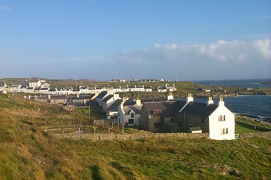 Picture of a view over Portnahaven with Port Wemyss in the background